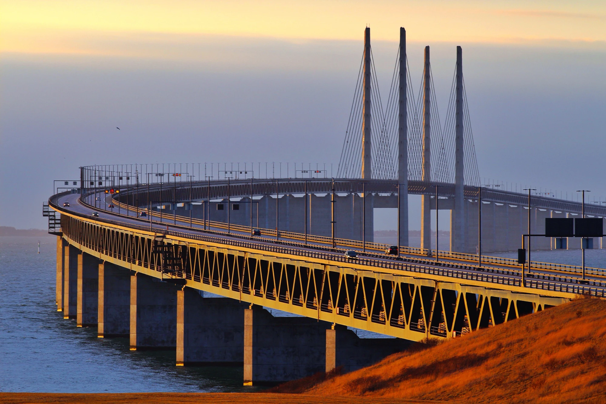 Chloride-Induced Corrosion: The Invisible Threat to Global Infrastructure Elegant bridge spanning calm waters.